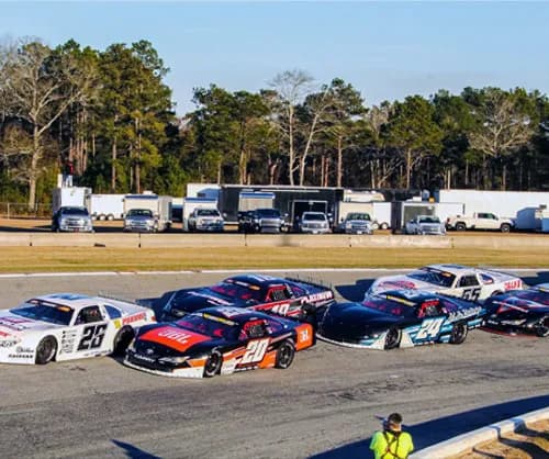 Late models racing side by side at Cordele Motor Speedway