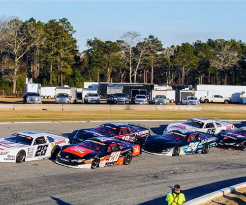 A field of late models side by side on the frontstretch at Cordele Motor Speedway