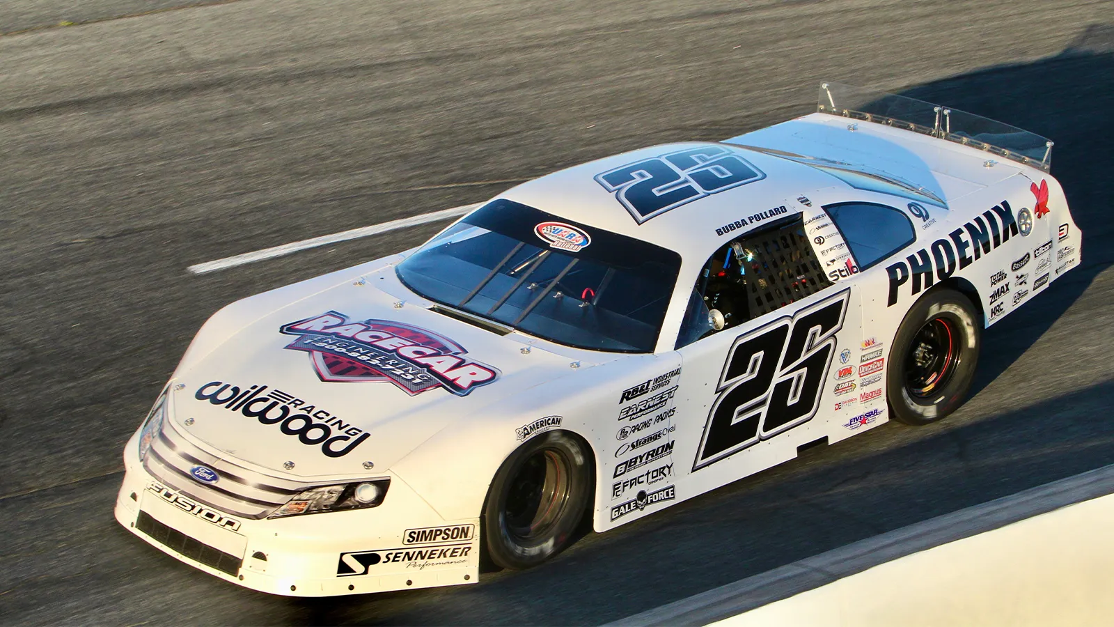 A white late model rolling around the track in practice